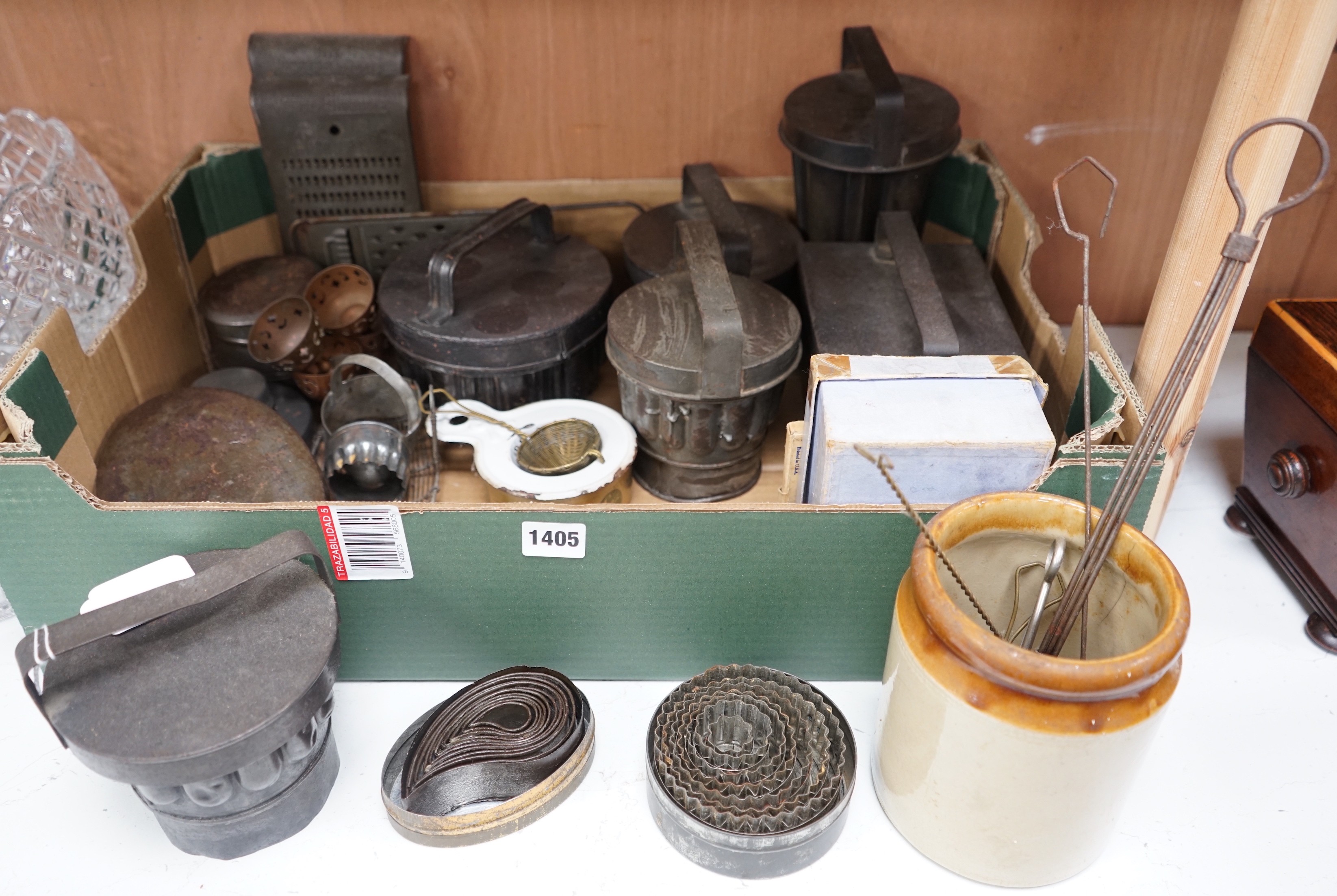 A good collection of tin plated iron jelly moulds, pastry moulds and kitchenalia